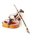 Brown wooden fiddle or violin, classic musical instrument, with bow on white background