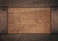 Brown wooden frame screwed on wood board Royalty Free Stock Photo