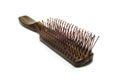 Brown wooden handle comb iso lated.