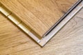 Brown wooden parquet floor planks installation , close up. Carpentry concept. Royalty Free Stock Photo