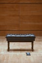 Brown piano stool on the stage in concert hall Royalty Free Stock Photo