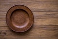 The brown wooden plate on a rustic table closeup. horizontal top