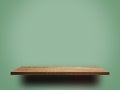 Brown wooden shelf for product display on green background