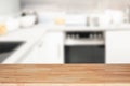 Brownwooden table top and blurred kitchen interior background Royalty Free Stock Photo