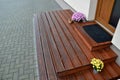 Brown wooden terrace at the entrance to the house. entrance staircase. the coating of the boards with serrations is in the shade o Royalty Free Stock Photo