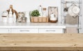 Brown wooden texture table over blurred image of kitchen bench