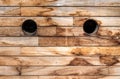 Brown wooden wall texture with portholes