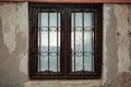 Brown wooden window with iron wrought iron