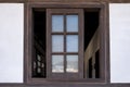 Brown wooden window opened on wall Royalty Free Stock Photo