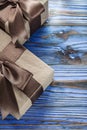 Brown wrapped birthday gifts on vintage wooden board