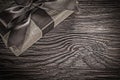 Brown wrapped present box on vintage wooden board