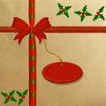 Brown wrapping paper with a red ribbon Royalty Free Stock Photo