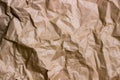 Brown wrinkle recycle paper background. Texture of crumpled paper. Texture of rumpled old paper close-up Royalty Free Stock Photo