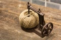 Brown yarn ball in a toy sewing machine