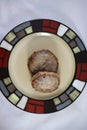 Browned sausage patties on plate Royalty Free Stock Photo