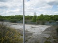 Brownfield land next to railway line Royalty Free Stock Photo