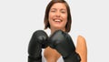 Brownhaired woman with boxing gloves