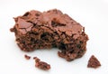 Brownie with bite-marks on white Royalty Free Stock Photo