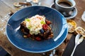 Brownie cake with salted caramel. Anglaise foam, raspberry sauce, praline nut and fresh berry. Delicious sweet dessert Royalty Free Stock Photo