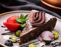 Brownie cake with a scoop of vanilla ice cream and strawberries Royalty Free Stock Photo