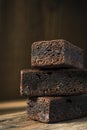 Brownie Cake Slices in Stack on Wooden Background Royalty Free Stock Photo