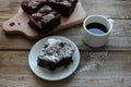 Brownie With Cherries On A Cut Board. Close-up Of Handmade Chocolate Cake With Coffee On Wooden Table Background.