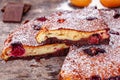 Brownie with cherries on wooden rustic table.