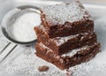 Brownie. Chocolate cakes with powdered sugar Royalty Free Stock Photo