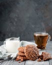 Brownie cookies on a wooden table with tea and milk. Copy space Royalty Free Stock Photo