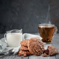 Brownie cookies on a wooden table with tea and milk. Copy space Royalty Free Stock Photo