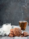 Brownie cookies on a wooden table with tea and milk. Copy space Royalty Free Stock Photo