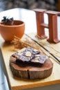 Brownie cracker with almond slides on wooden plate Royalty Free Stock Photo