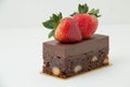 Brownie desert with strawberries on top. Royalty Free Stock Photo