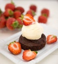 Brownie with ice cream and strawberries Royalty Free Stock Photo