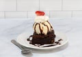 Brownie Ice Cream Sundae topped with a strawberry slice Royalty Free Stock Photo