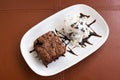 Brownie and icecream. On white plate. Royalty Free Stock Photo