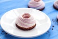 Brownie, white-pink marshmallows, jam, cookies, chocolate on a white plate. Closeup. Top view. Place for text