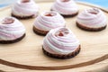 Brownie, white-pink marshmallows, jam, cookies, chocolate on a wooden background. Close-up