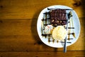 Brownies cake with vanilla ice cream.