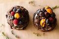 Chocolate cake with berries, wooden backdrop