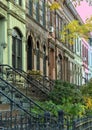 brownstone detail (colorful historic brick residential buildings in brooklyn) nyc homes on a tree lined block in autumn