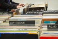 Browsing through old vinyl records in music shop. Music background. Royalty Free Stock Photo