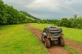 BRP Can-Am quad bike in Caucasus mountains green forest background. ATV and SSV travel adventure and nature exploration concept Royalty Free Stock Photo