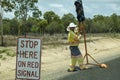 Road Crew Worker Holding Stop Sign