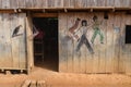 A Bruce Lee style Kung Fu fight scene mural painted on a wooden building in the Amazon rainforest. Iquitos, Peru