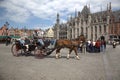 Bruge Belgium. Main Square with horse and trap containing tourists