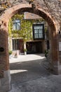 Bruges, BELGIUM - 16 April 2017: A charming entrance to thouse with an arch in Brugge, Belgium