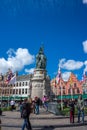 Bruges, BELGIUM - 16 April 2017: A couple kiss in centre of the square in Bruges, Belgium Royalty Free Stock Photo