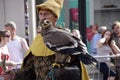 Charcter with a bird of prey in The Procession of the Golden Tree Pageant, held every 5 years since 1958.