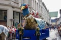 Marchers with a giant bird float in The Procession of the Golden Tree Pageant, held every 5 years since 1958.